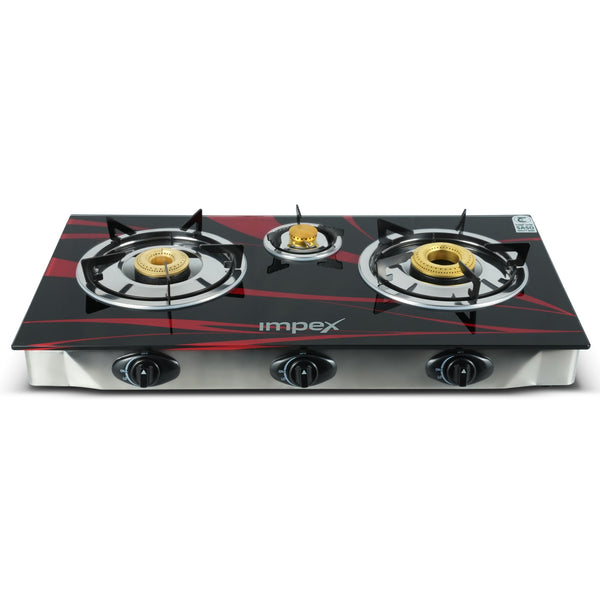 A three-burner gas stove with a glossy black glass front, accented with red graphic lines and gold burner caps. The brand name 'implex' is printed in white on the front.